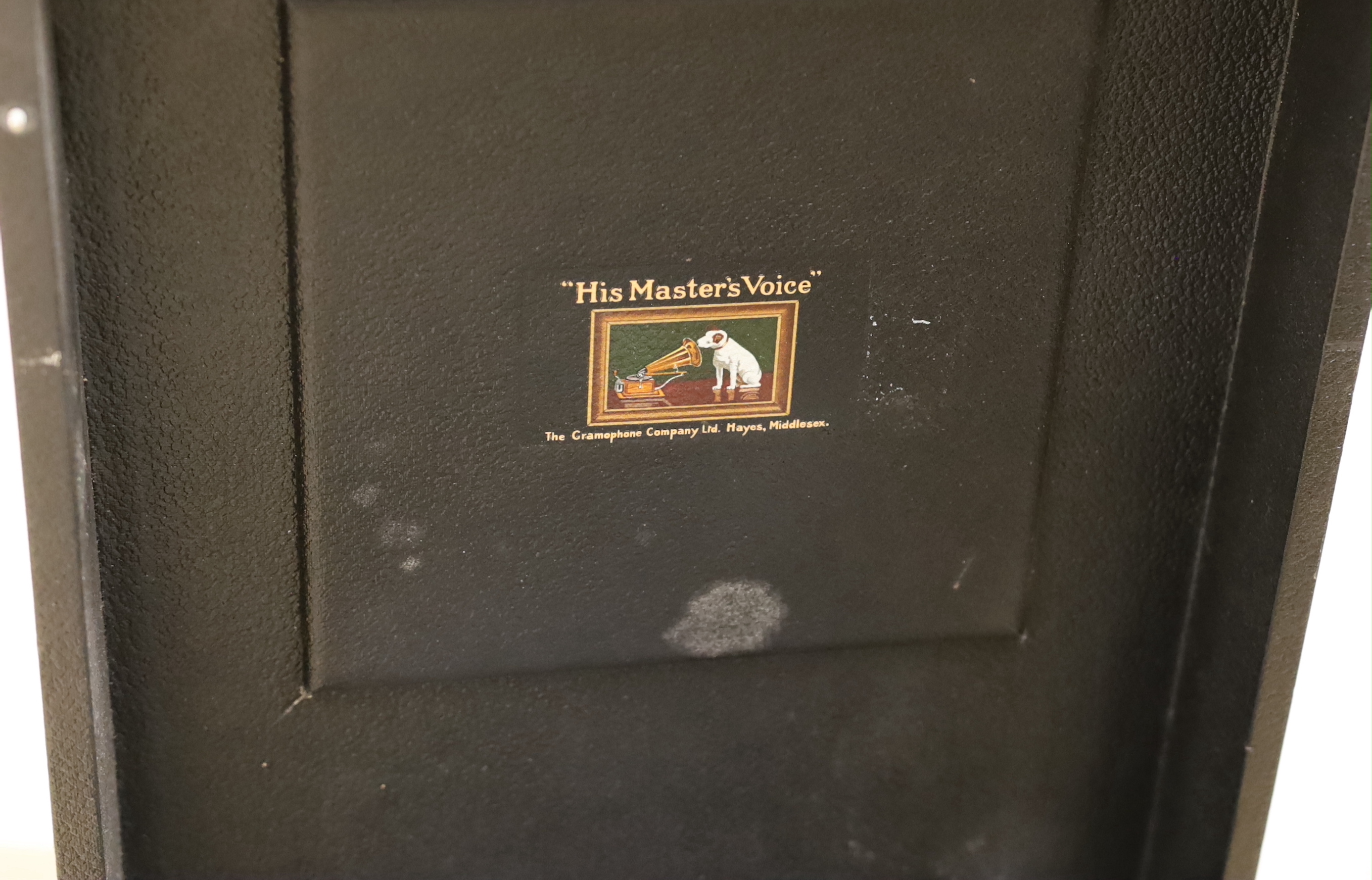 An HMV gramophone and a portable HMV gramophone, together with a small number of 78s